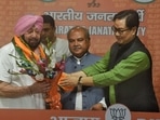Former Punjab CM Capt Amarinder Singh joins BJP in the presence of Union Ministers Narendra Singh Tomar, Kiren Rijiju, BJP leader Sunil Jakhar and BJP Punjab chief Ashwani Sharma.(Raj k Raj/ HT Photo)
