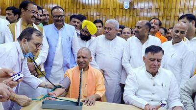 Chief minister Yogi Adityanath and state assembly speaker Satish Mahana at the health camp inaugurated in the Vidhan Bhavan on Monday. (HT PHOTO)