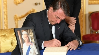 Brazilian President Jair Bolsonaro signs a book of condolence at Lancaster House in London, following the death of Queen Elizabeth II. Following the state funeral, the coffin will travel in procession from Westminster Abbey to Wellington Arch, after which the coffin will travel to Windsor and once there, the State Hearse will travel in procession to St George's Chapel, Windsor Castle via the Long Walk. (REUTERS)
