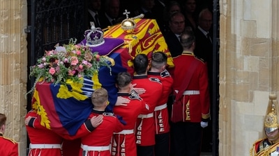 Queen Elizabeth II Funeral: The Bearer Party take the coffin of Queen Elizabeth II, from the State Hearse, into St George's Chapel inside Windsor Castle. (AFP) Queen Elizabeth II Funeral: The Bearer Party take the coffin of Queen Elizabeth II, from the State Hearse, into St George's Chapel inside Windsor Castle. (AFP)