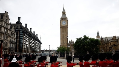 Queen Elizabeth II's Funeral: Grenadier Guards march past the Elizabeth Tower, more commonly known as Big Ben in London. (AFP) Queen Elizabeth II's Funeral: Grenadier Guards march past the Elizabeth Tower, more commonly known as Big Ben in London. (AFP)