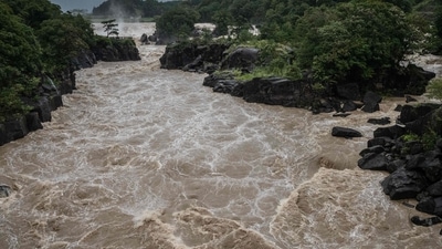 Typhoon Nanmadol: Raging waters flow along the Sendai River in the wake of Typhoon Nanmadol in Isa, Kagoshima. (AFP)