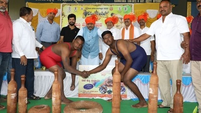 A senior wrestler is paired with a junior wrestler to compete against an opponent during the competitions. (Twitter)