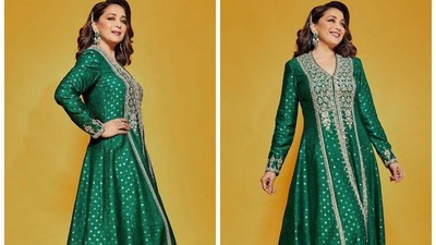 Madhuri Dixit earlier stepped out in a gorgeous emerald green anarkali sharara dress with gota patti work and intricate embellishment. (Instagram/@madhuridixit)