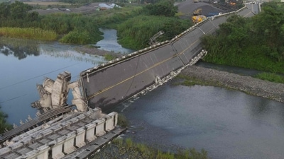 All four people were rescued from a building that collapsed in Yuli, while three people whose vehicles fell off a damaged bridge were rescued and taken to hospital. (AFP)