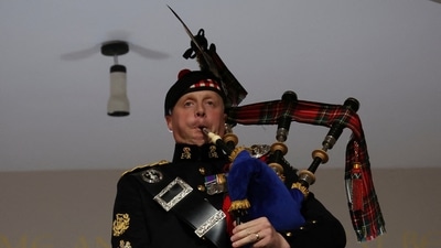 A piper plays during the funeral of Britain's Queen Elizabeth II, in London, Monday. (AP) A piper plays during the funeral of Britain's Queen Elizabeth II, in London, Monday. (AP)
