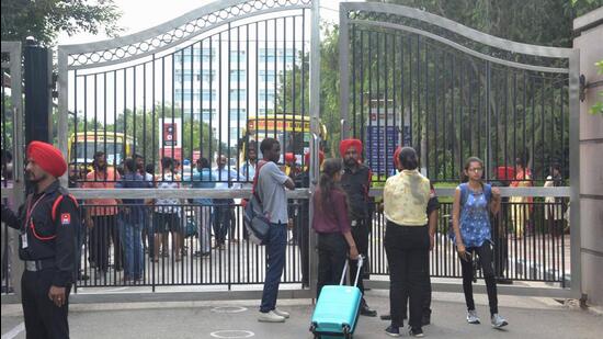 Students leaving the Chandigarh University after the authorities decided to shut it till September 24 in wake of the ongoing video leak row. (SANJEEV SHARMA/HT)