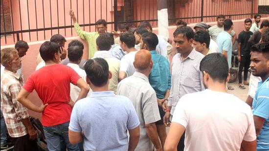 Family members of the deceased at the MMG Hospital mortuary in Ghaziabad on Monday. (Sakib Ali/ HT)