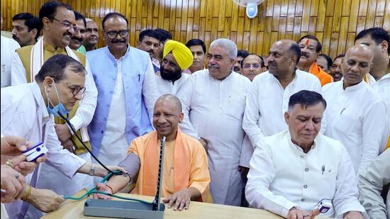 Chief minister Yogi Adityanath and state assembly speaker Satish Mahana at the health camp inaugurated in the Vidhan Bhavan on Monday. (HT PHOTO)