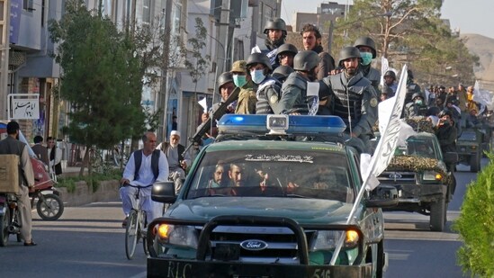 In this photograph taken on September 13, 2022, newly recruited Taliban fighters parade in vehicles after their graduation ceremony in Herat.(AFP)