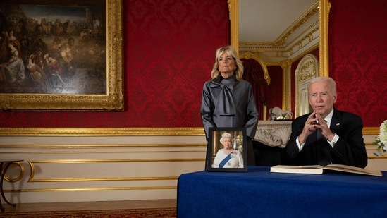 US First Lady Jill Biden (L) looks on as US President Joe Biden speaks after signing a book of condolence at Lancaster House in London, following the death of Queen Elizabeth II on September 8.(AFP)