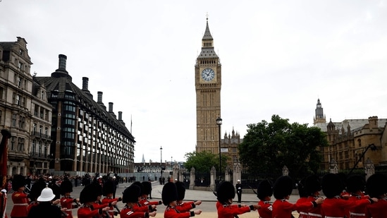 Queen Elizabeth II's Funeral: Grenadier Guards march past the Elizabeth Tower, more commonly known as Big Ben in London.(AFP)