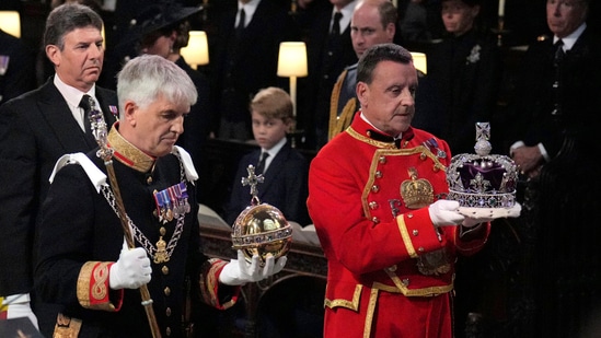 Queen Elizabeth II's Funeral: The Imperial State Crown, orb and sceptre are carried to the Dean of Windsor.(AP)