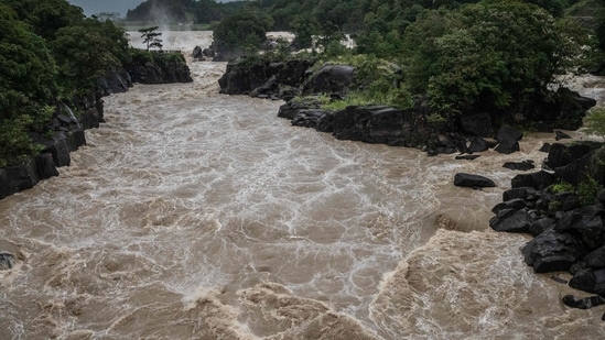 Typhoon Nanmadol: Raging waters flow along the Sendai River in the wake of Typhoon Nanmadol in Isa, Kagoshima. (AFP)