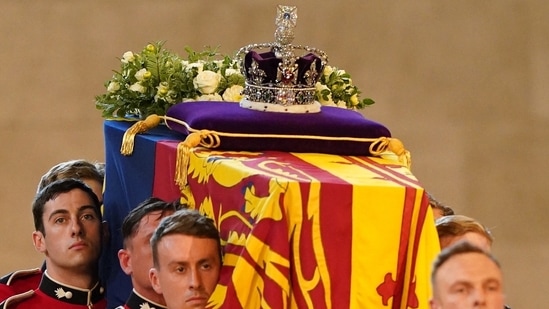 Queen Elizabeth II's Funeral: Guards carry the coffin of Queen Elizabeth II into Westminster Hall.(AFP)