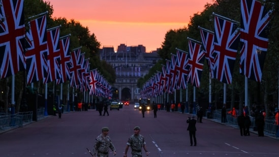 Queen Elizabeth II Funeral: British army soldiers walk along The Mall, ahead of the state funeral of Queen Elizabeth II, in London.(Bloomberg)