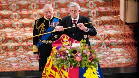 King Charles III watches as the Lord Chamberlain breaks his Wand of Office during the Committal Service for Queen Elizabeth II at St George's Chapel, at Windsor Castle, Windsor, England. (Ben Birchall/Pool via AP)