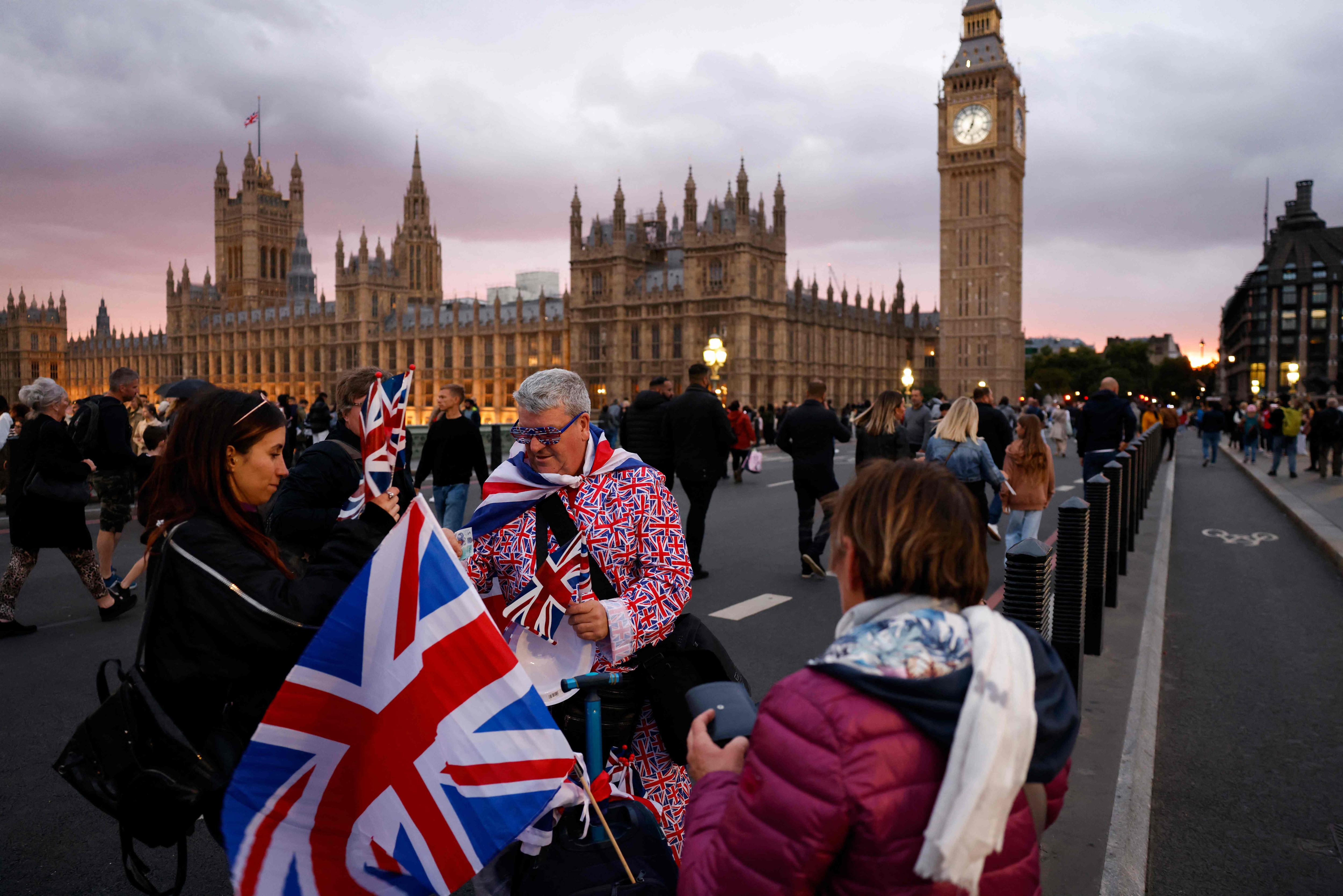 A street vendor sells Union Jack flags to well-wishers on Westminster Bridge in London. (AFP)