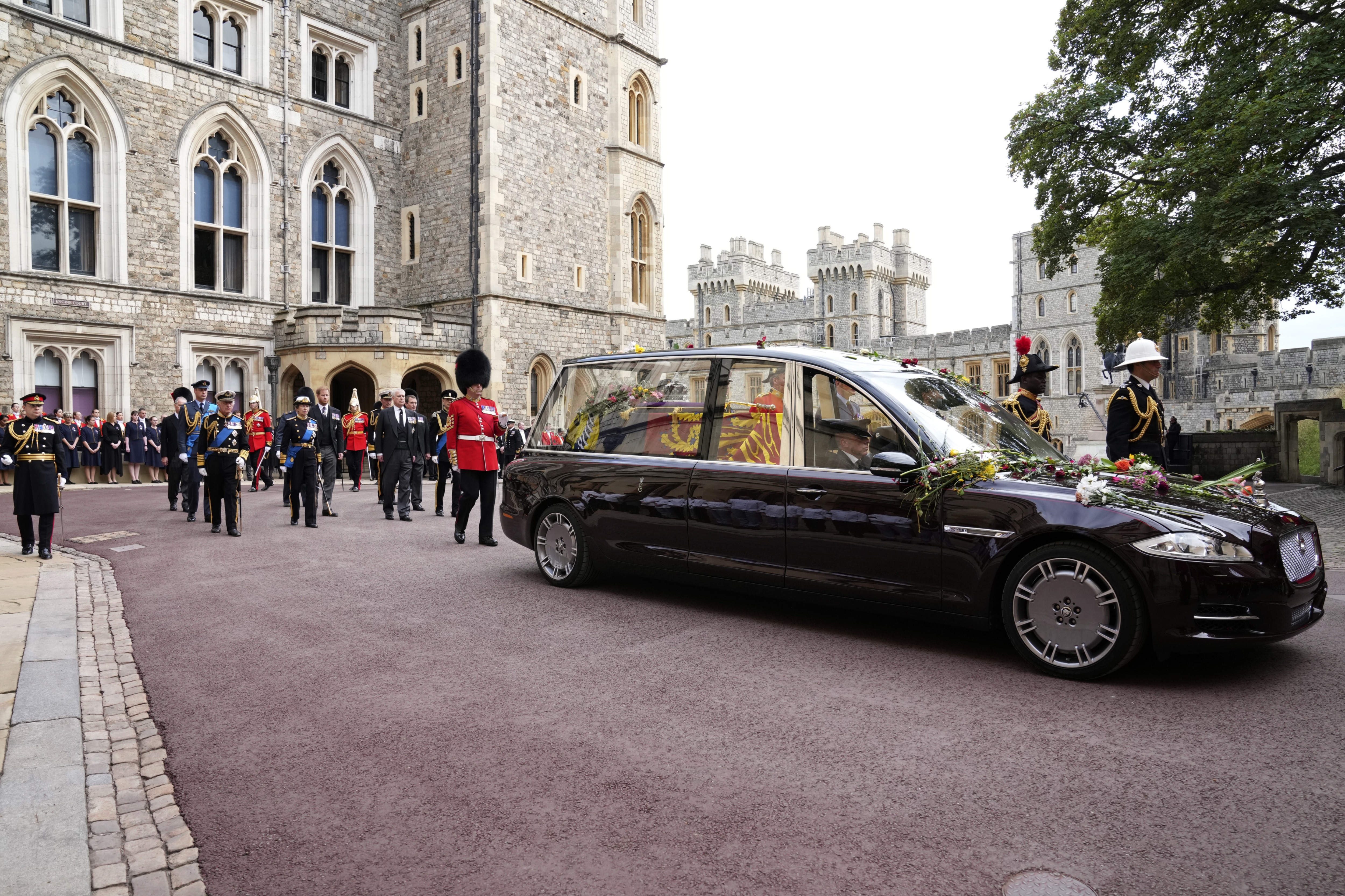 The hearse with the coffin of Queen Elizabeth II moves towards St. George's Chapel at the Windsor Castle, in Windsor. (AP)