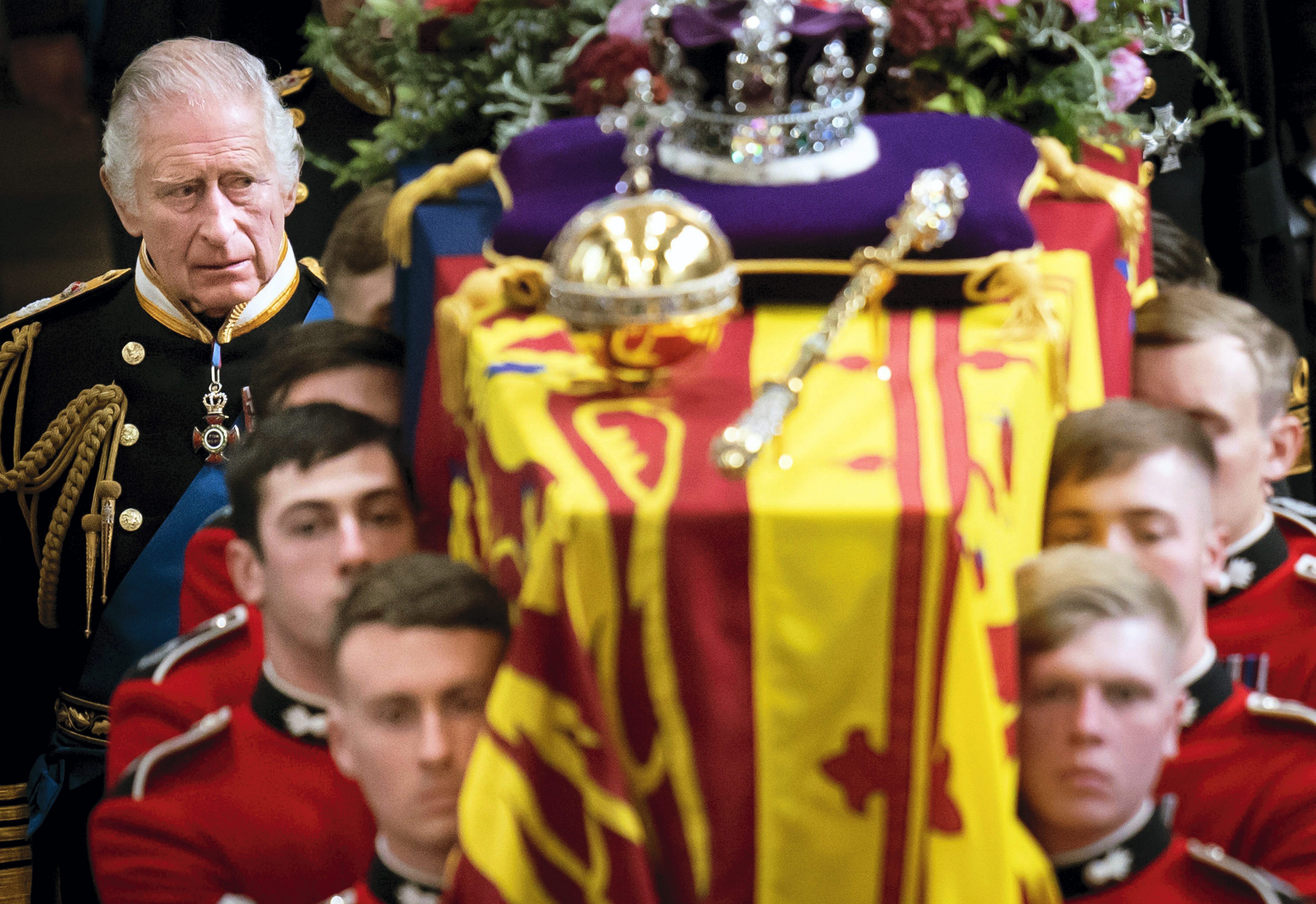 King Charles III and members of the Royal family follow behind the coffin of Queen Elizabeth II, draped in the Royal Standard with the Imperial State Crown and the Sovereign's orb and sceptre, as it is carried out of Westminster Abbey after her State Funeral, in London, on Monday. (AP/PTI Photo) King Charles III and members of the Royal family follow behind the coffin of Queen Elizabeth II, draped in the Royal Standard with the Imperial State Crown and the Sovereign's orb and sceptre, as it is carried out of Westminster Abbey after her State Funeral, in London, on Monday. (AP/PTI Photo)