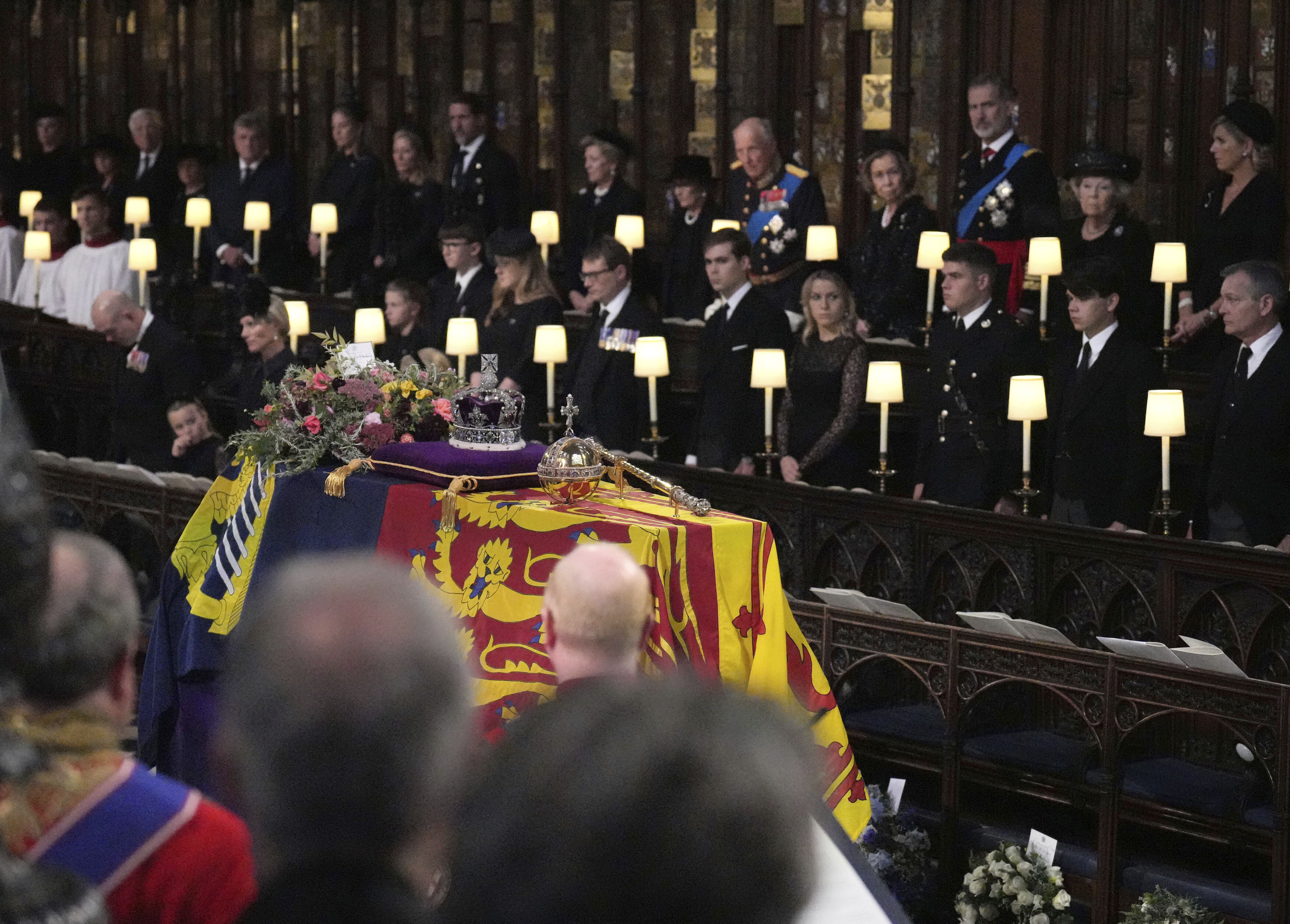 Members of the royal family stand for the coffin of Queen Elizabeth II during the committal service for Queen Elizabeth II, at St. George's Chapel, in Windsor, England. (Victoria Jones/Pool Photo via AP) Members of the royal family stand for the coffin of Queen Elizabeth II during the committal service for Queen Elizabeth II, at St. George's Chapel, in Windsor, England. (Victoria Jones/Pool Photo via AP)