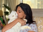 Aahana Kumra chilling at her home with her cat. Aahana Kumra chilling at her home with her cat.