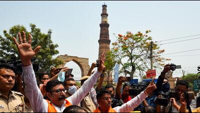 Members of a right-wing group recite Hanuman Chalisa outside the Qutub Minar demanding that it be renamed as 'Vishnu Stambh' in May 2022. (HT File Photo/Amal KS) Members of a right-wing group recite Hanuman Chalisa outside the Qutub Minar demanding that it be renamed as 'Vishnu Stambh' in May 2022. (HT File Photo/Amal KS)