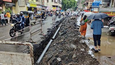 A dug up road at Narpatgiri chowk in Pune. (HT FILE PHOTO)