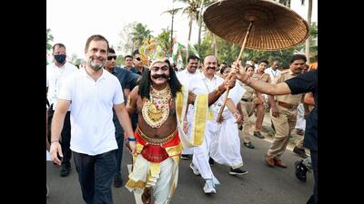Congress leader Rahul Gandhi walks with a man dressed as fabled King Mahabali during the 13th day of his party's ‘Bharat Jodo Yatra’ in Kerala’s Alappuzha on Tuesday. (AICC Twitter Photo) Congress leader Rahul Gandhi walks with a man dressed as fabled King Mahabali during the 13th day of his party's ‘Bharat Jodo Yatra’ in Kerala’s Alappuzha on Tuesday. (AICC Twitter Photo)