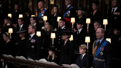 Queen Elizabeth II's Funeral: Meghan, Duchess of Sussex, Prince Harry, the Duke of Sussex, Princess Charlotte, Kate the Princess of Wales, Prince George and Prince William sing. (AP) Queen Elizabeth II's Funeral: Meghan, Duchess of Sussex, Prince Harry, the Duke of Sussex, Princess Charlotte, Kate the Princess of Wales, Prince George and Prince William sing. (AP)