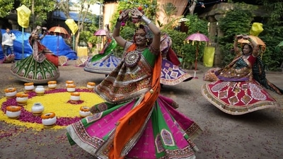 Women wearing traditional attire practice the Garba, the traditional dance of Gujarat state, ahead of Navratri in Ahmedabad, India, Tuesday, Sept. 20, 2022. The Hindu festival of Navratri, or nine nights, will begin Sept. 26. Here are easy tips to keep constipation at bay this Navratri (AP Photo/Ajit Solanki)