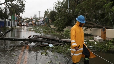 Hurricane Fiona: A worker removes utility poles in the aftermath of Hurricane Fiona in Higuey, Dominican Republic. (Reuters)