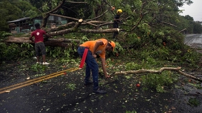 Footage from local media showed residents of the east coast town of Higuey waist-deep in water, trying to salvage personal belongings. (AFP) Footage from local media showed residents of the east coast town of Higuey waist-deep in water, trying to salvage personal belongings. (AFP)
