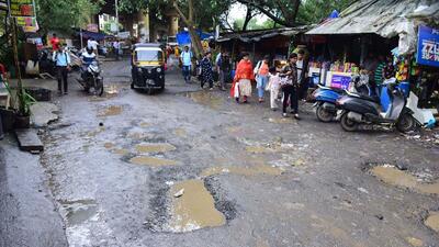 The 27-year-old banker has been trying to draw the attention of Brihanmumbai Municipal Corporation (BMC) and railway authorities to fix this pothole-ridden way for the last one month (VIjay Bate) The 27-year-old banker has been trying to draw the attention of Brihanmumbai Municipal Corporation (BMC) and railway authorities to fix this pothole-ridden way for the last one month (VIjay Bate)