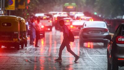 Commuters in the rain near Connaught Place in Delhi on Tuesday. (Raj K Raj/HT Photo) Commuters in the rain near Connaught Place in Delhi on Tuesday. (Raj K Raj/HT Photo)