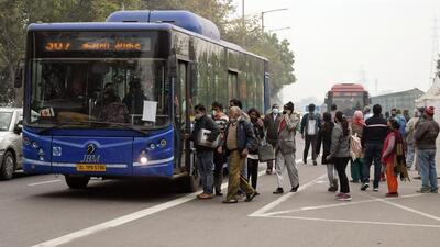 People boarding a Delhi public bus. (ANI) People boarding a Delhi public bus. (ANI)