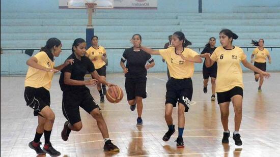 Players in action during a basketball match at the district-level games being held under Khedan Watan Punjab Diyan in Ludhiana. (Harvinder Singh/HT)