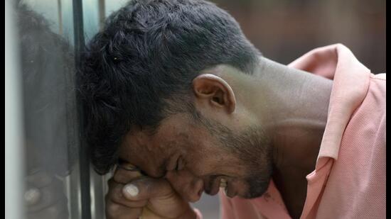 Noida, India- September 20, 2022: Brother of Pushpendra, a victim of the wall collapse incident breaks down outside the mortuary at sector 30, in Noida, India, on Tuesday, September 20, 2022. (Photo by Sunil Ghosh / Hindustan Times) (Hindustan Times)