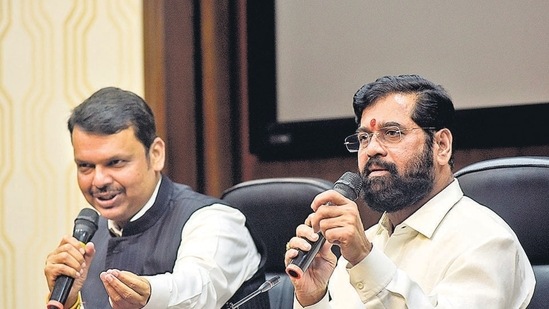 Chief Minister of Maharashtra Eknath Shinde with Deputy CM Devendra Fadnavis during a press conference.