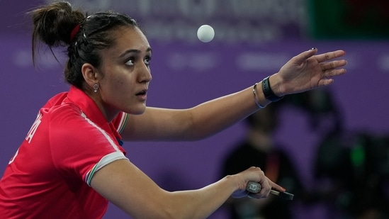 India's Manika Batra competes against Fiji's Carolyn LI in the women's team event competition at the Commonwealth Games(AP)