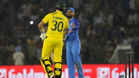 Virat Kohli congratulates Pat Cummins after Australia's four-wicket win in the first T20 in Mohali(AP)