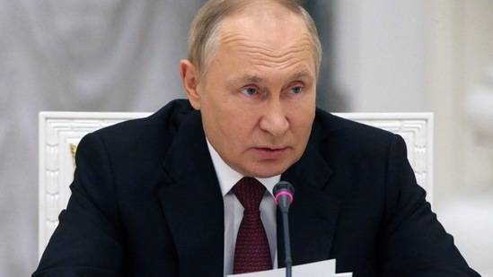 Russian President Vladimir Putin chairs a meeting.(AFP)
