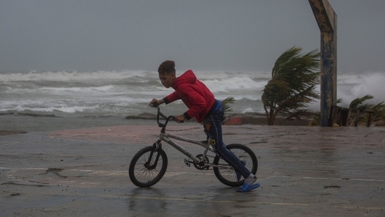 Red alerts were in effect in seven of the island's 32 provinces, down from 18 earlier in the day, with more than 12,000 people sheltering in safe areas, according to emergency services.(AFP)