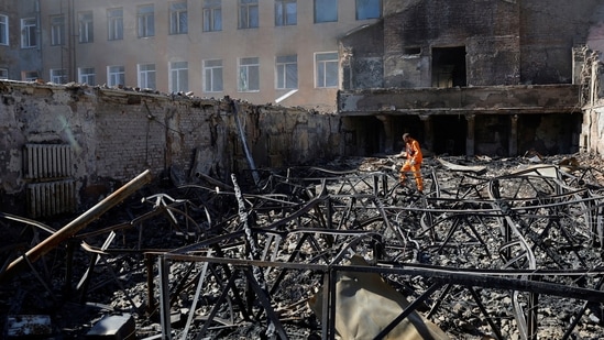 Russia-Ukraine War A man walks through the ruins of a building destroyed by recent shelling in Ukraine.(Reuters)