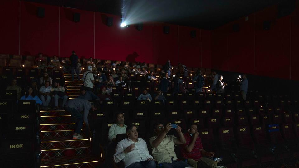 People watch a movie during the inauguration of Kashmir’s first multiplex cinema in Srinagar on Tuesday. (AP) People watch a movie during the inauguration of Kashmir’s first multiplex cinema in Srinagar on Tuesday. (AP)