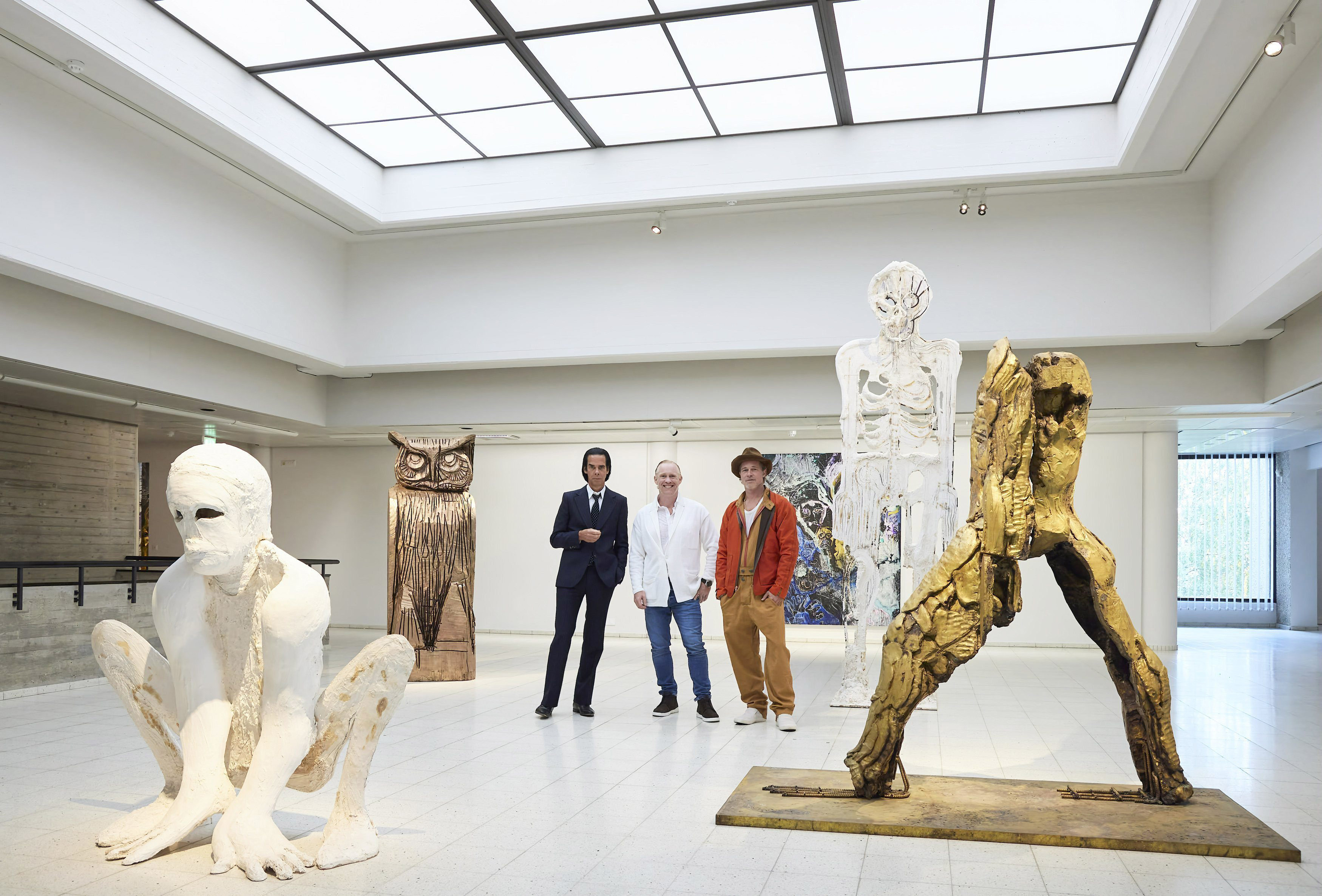In this photo provided by Sara Hilden Art Museum, British artist Thomas Houseago, centre, poses with US actor Brad Pitt, centre right and Australian musician Nick Cave, prior to the opening of their joint exhibition, in Tampere, Finland, Saturday, Sept. 17, 2022. (Jussi Koivunen/Sara Hilden Art Museum, Lehtikuva via AP) (AP) In this photo provided by Sara Hilden Art Museum, British artist Thomas Houseago, centre, poses with US actor Brad Pitt, centre right and Australian musician Nick Cave, prior to the opening of their joint exhibition, in Tampere, Finland, Saturday, Sept. 17, 2022. (Jussi Koivunen/Sara Hilden Art Museum, Lehtikuva via AP) (AP)