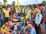 Agitators from the Kurmi community block railway tracks to press for their demand for Scheduled Tribe (ST) status, in West Bengal on Wedneday, Sept. 21, 2022. (PTI) Agitators from the Kurmi community block railway tracks to press for their demand for Scheduled Tribe (ST) status, in West Bengal on Wedneday, Sept. 21, 2022. (PTI)