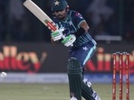 Pakistan's captain Babar Azam plays a shot during the first T20 cricket match between Pakistan and England(AP) Pakistan's captain Babar Azam plays a shot during the first T20 cricket match between Pakistan and England(AP)