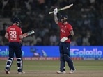 England's Alex Hales, right, celebrates after scoring fifty during the first T20I between Pakistan and England, in Karachi, Pakistan.