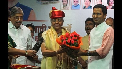 (From left) State education minister Chandrakant Patil, finance minister Nirmala Sitharaman and BJP Pune city chief Jagdish Mulik at Symbiosys Vishwa Bhavan on Wednesday. (Ravindra Joshi/HT PHOTO)